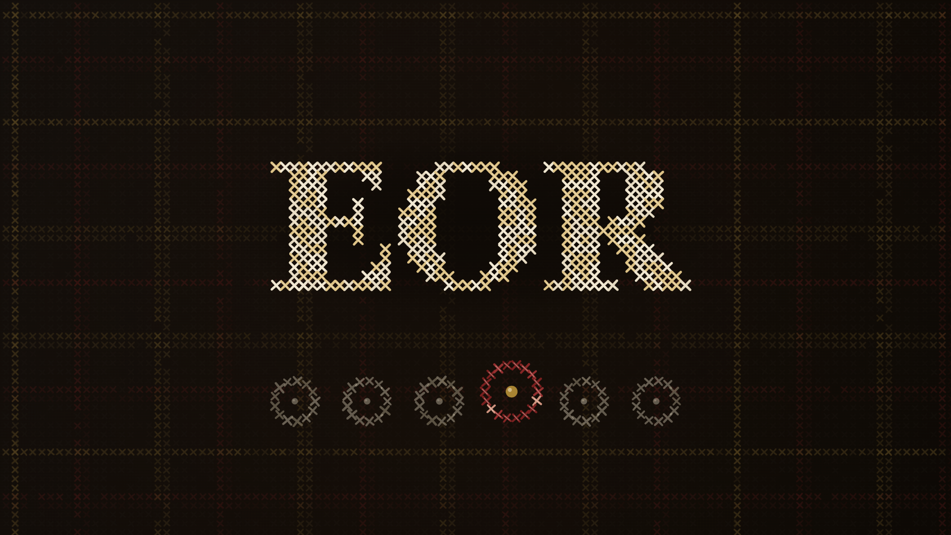 EOR letters in gold cross-stitch on a woven tartan of gold and crimson thread